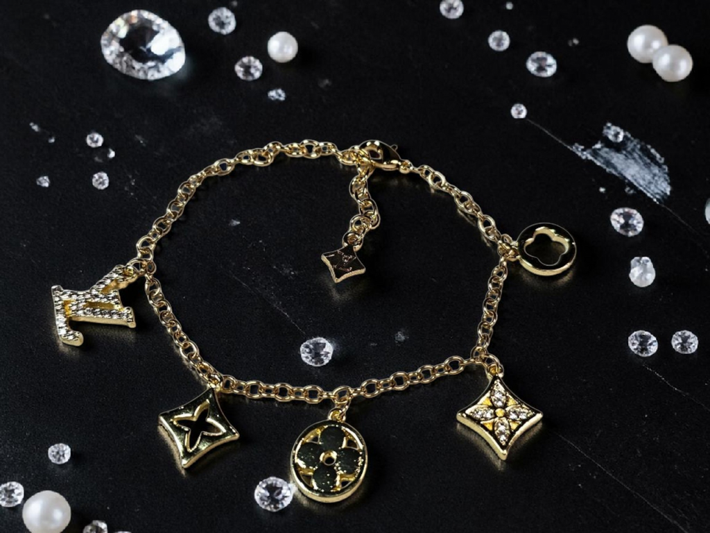 Logo charm bracelet with luxury multi-charm design