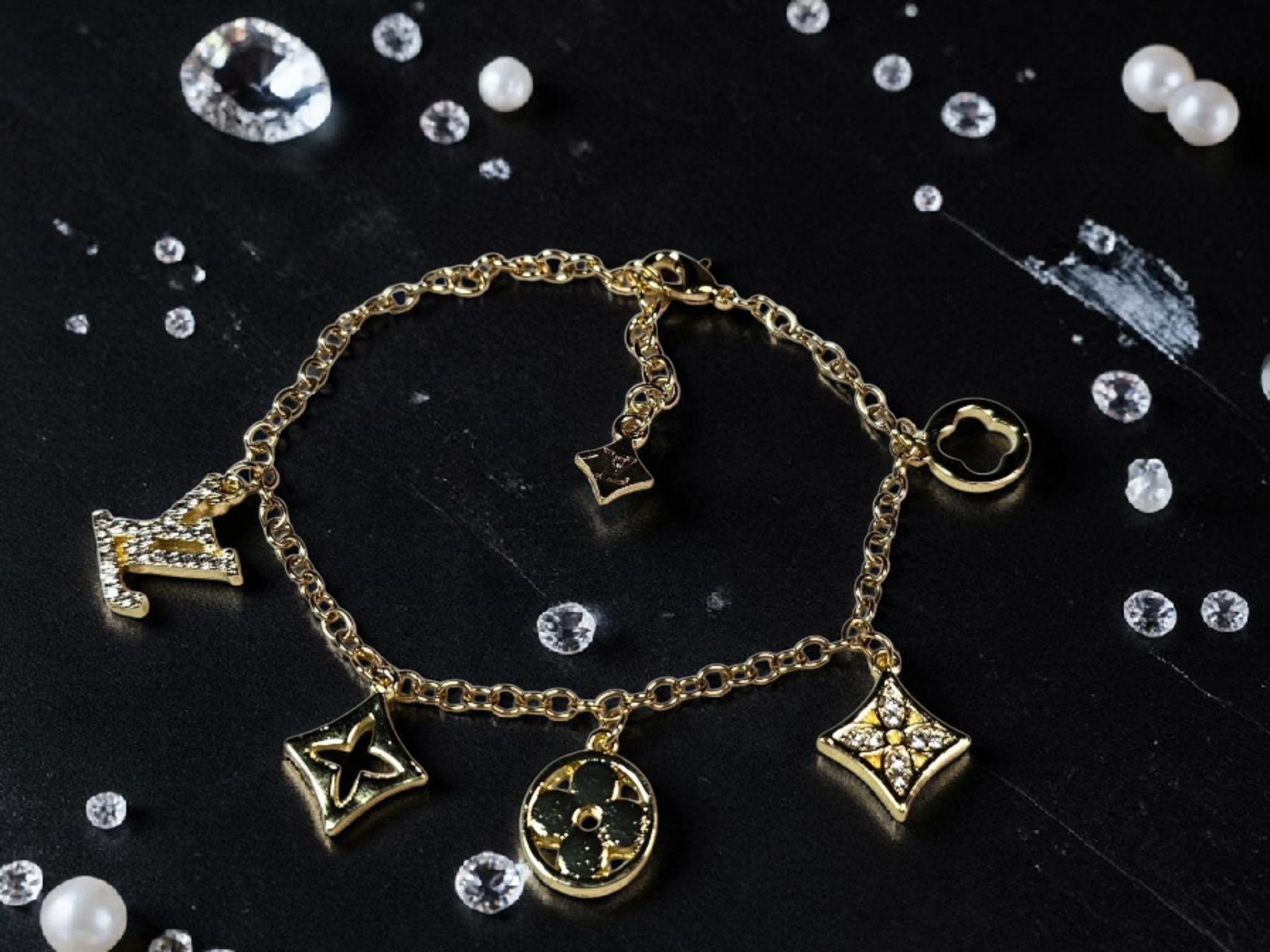 Logo charm bracelet with luxury multi-charm design