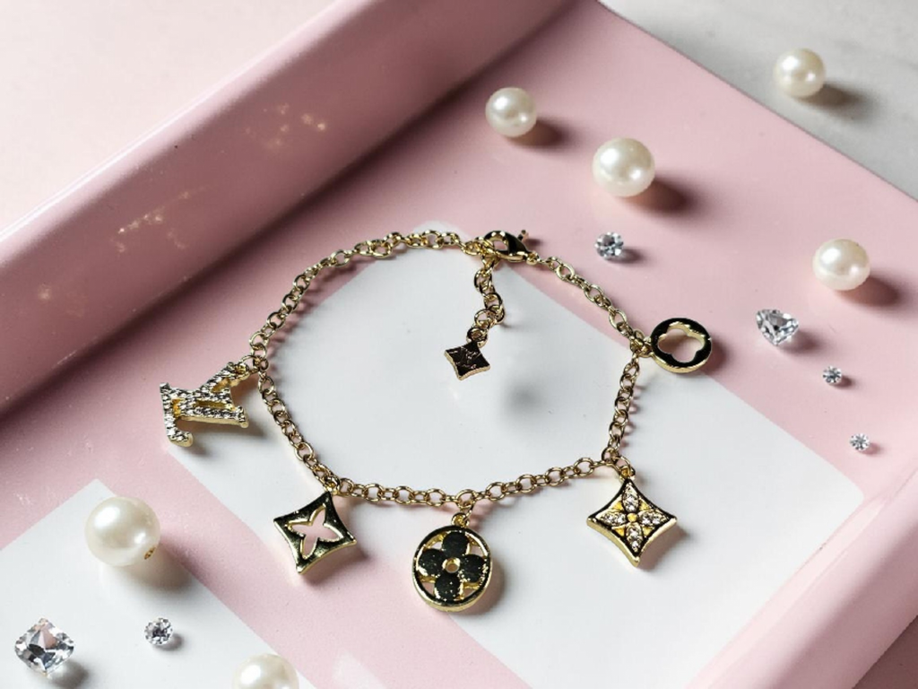Logo charm bracelet with luxury multi-charm design