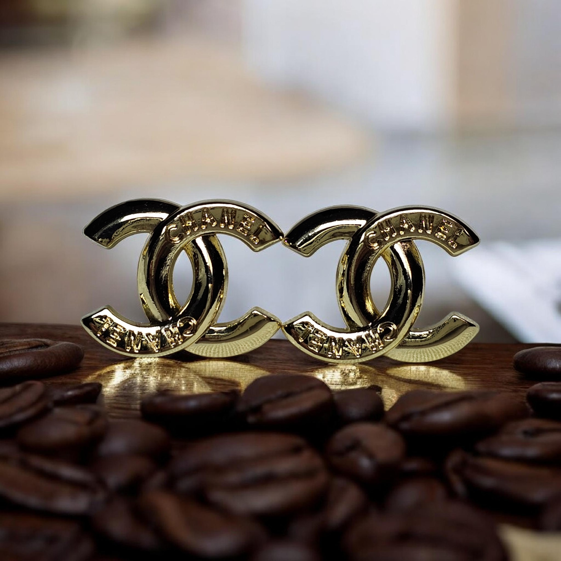 Chanel logo charm CC pierced stud earrings