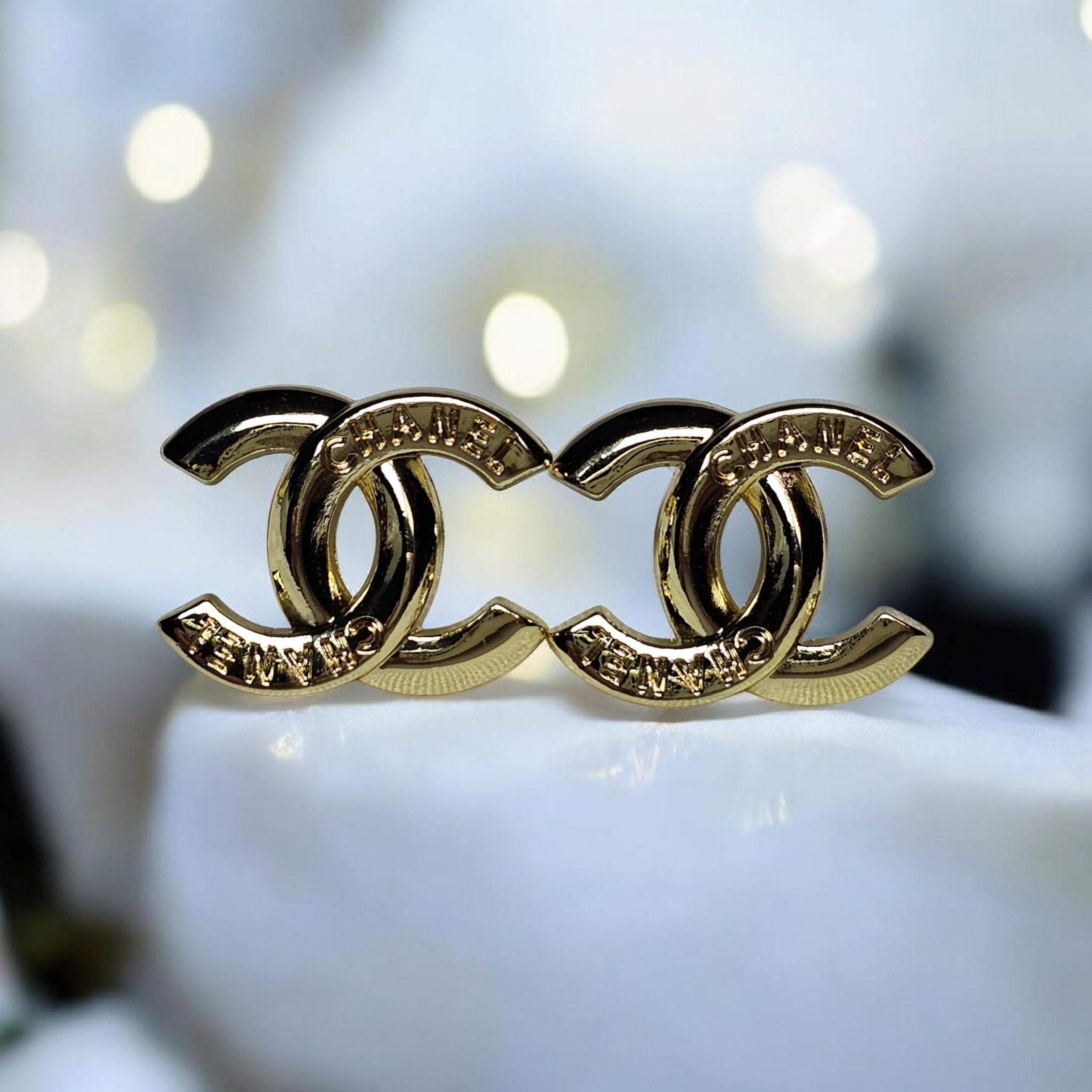 Chanel logo charm CC pierced stud earrings