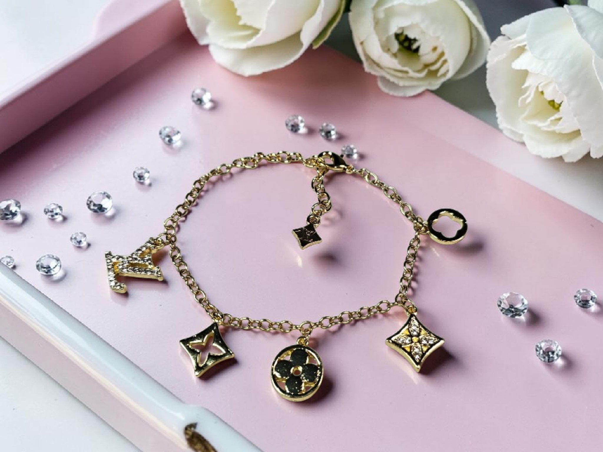 Logo charm bracelet with luxury multi-charm design