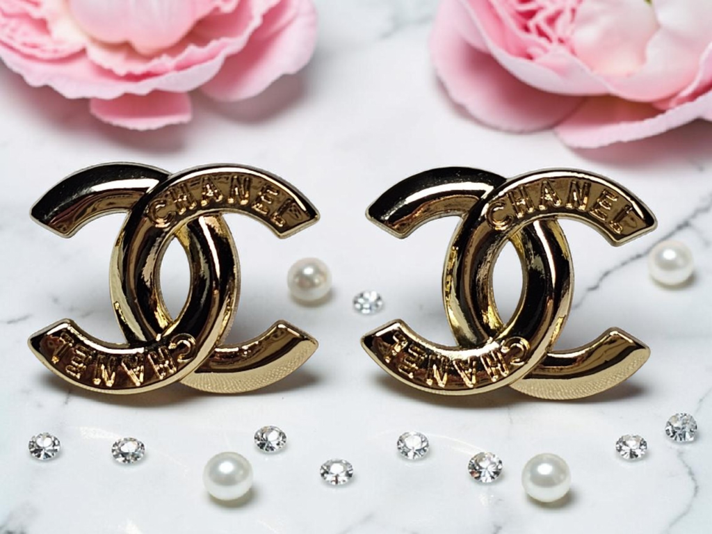 Logo charm gold pierced stud earrings