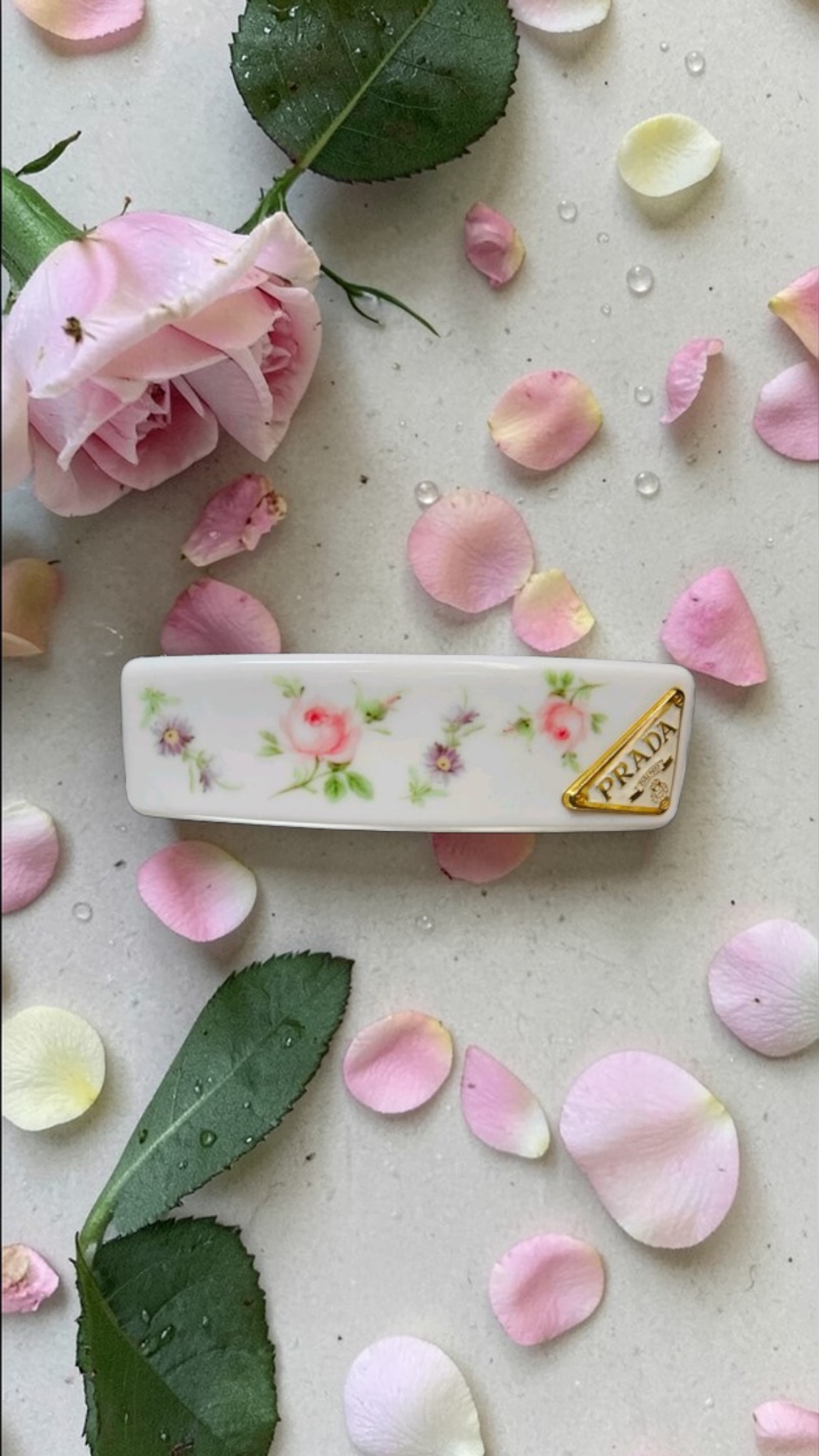 Prada White floral with Gold logo charm Hair Clip