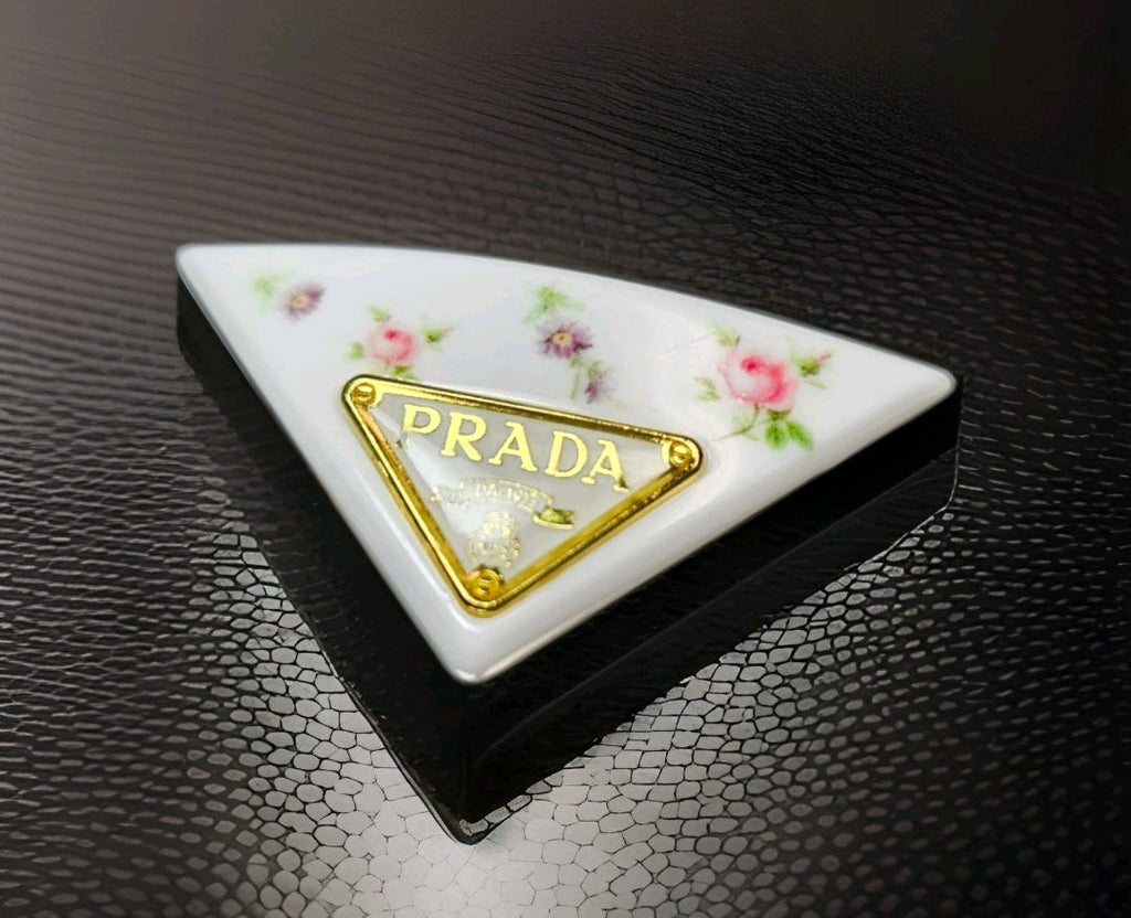 Prada Gold Logo charm White Floral Triangle Floral Hair Clip