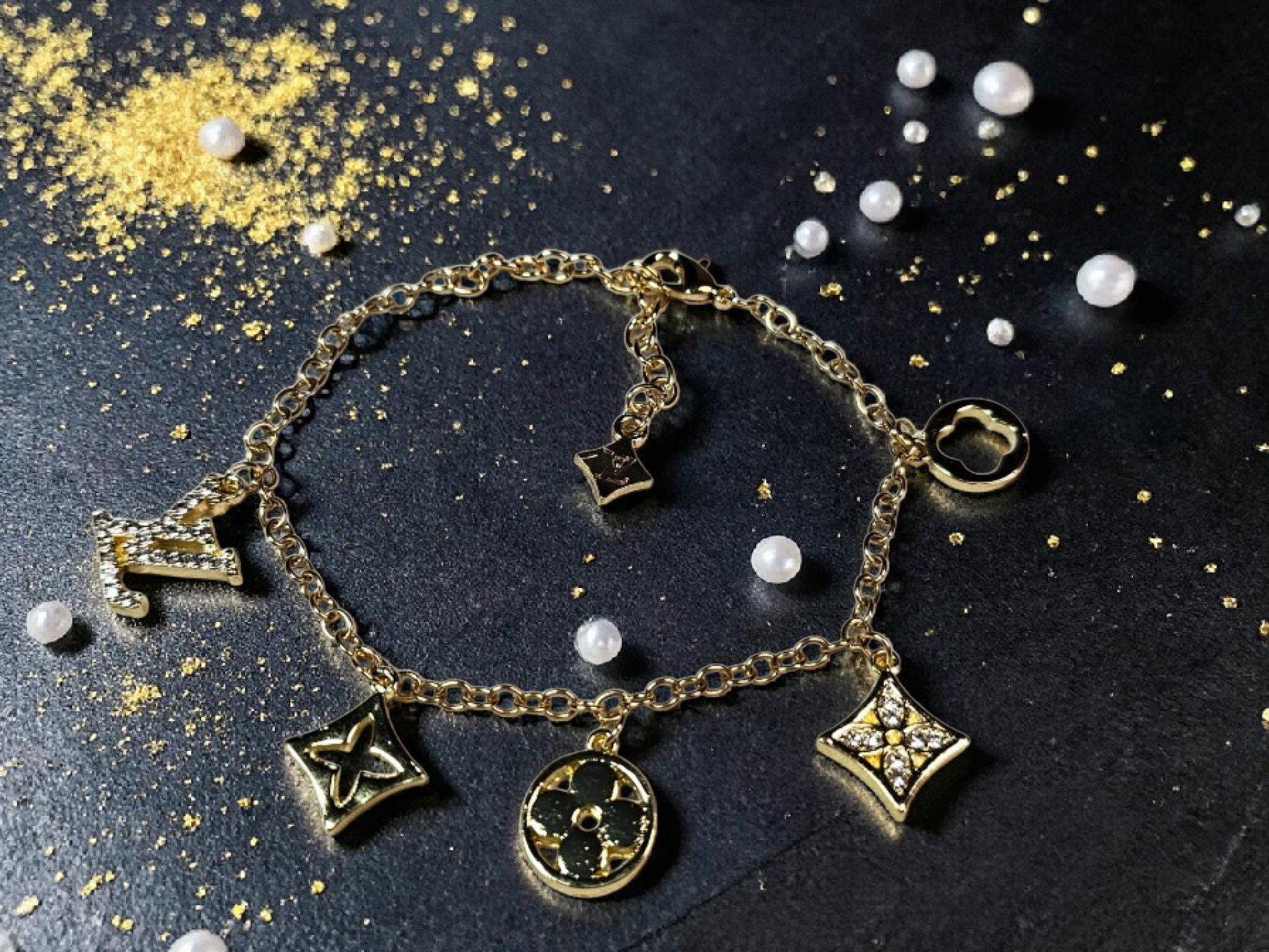 Logo charm bracelet with luxury multi-charm design