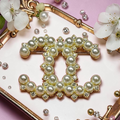 Gold and Continuous Pearl Charm Brooch