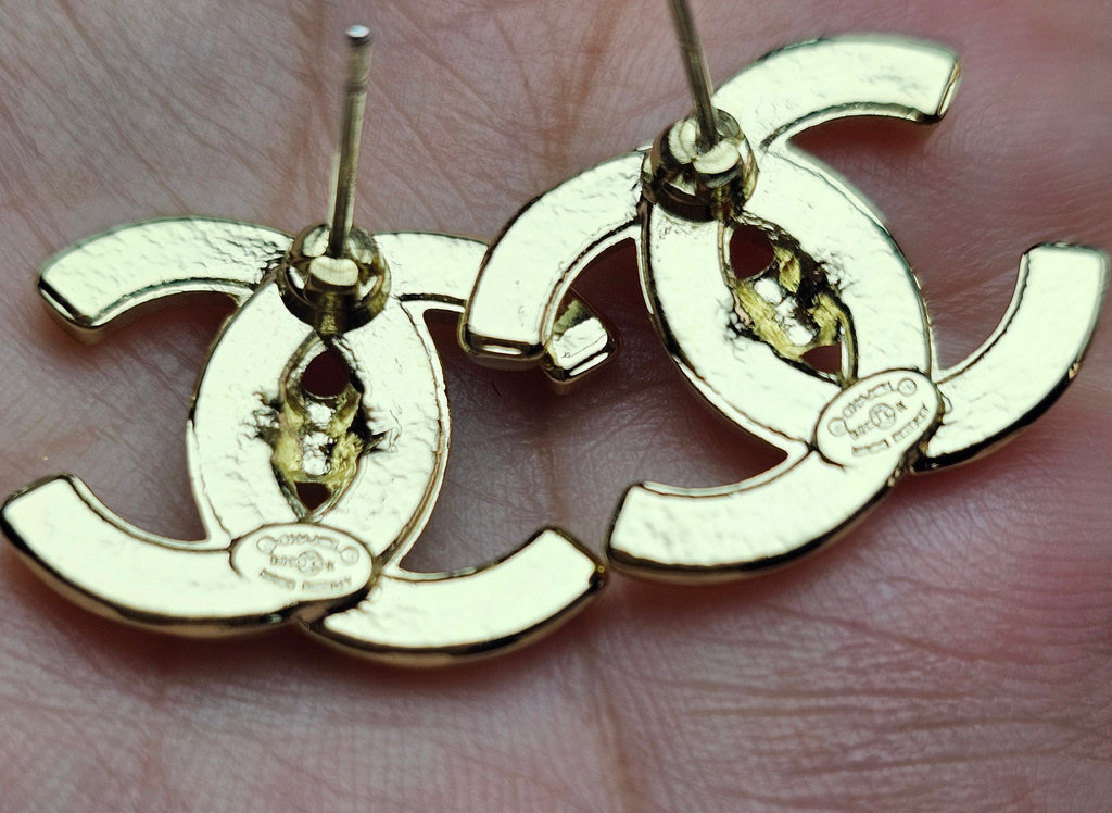 Logo charm gold pierced stud earrings
