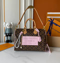 30 cm Barrel Bag with monogram logo and pink accents