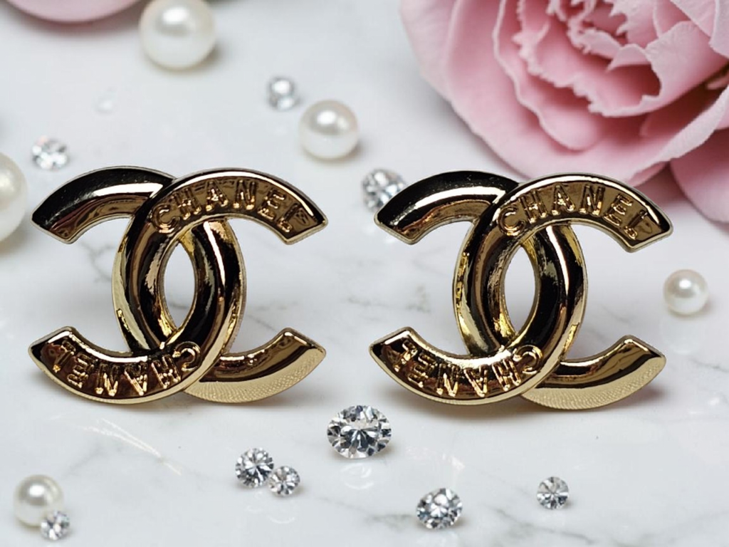 Logo charm gold pierced stud earrings