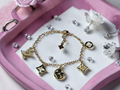 Logo charm bracelet with luxury multi-charm design