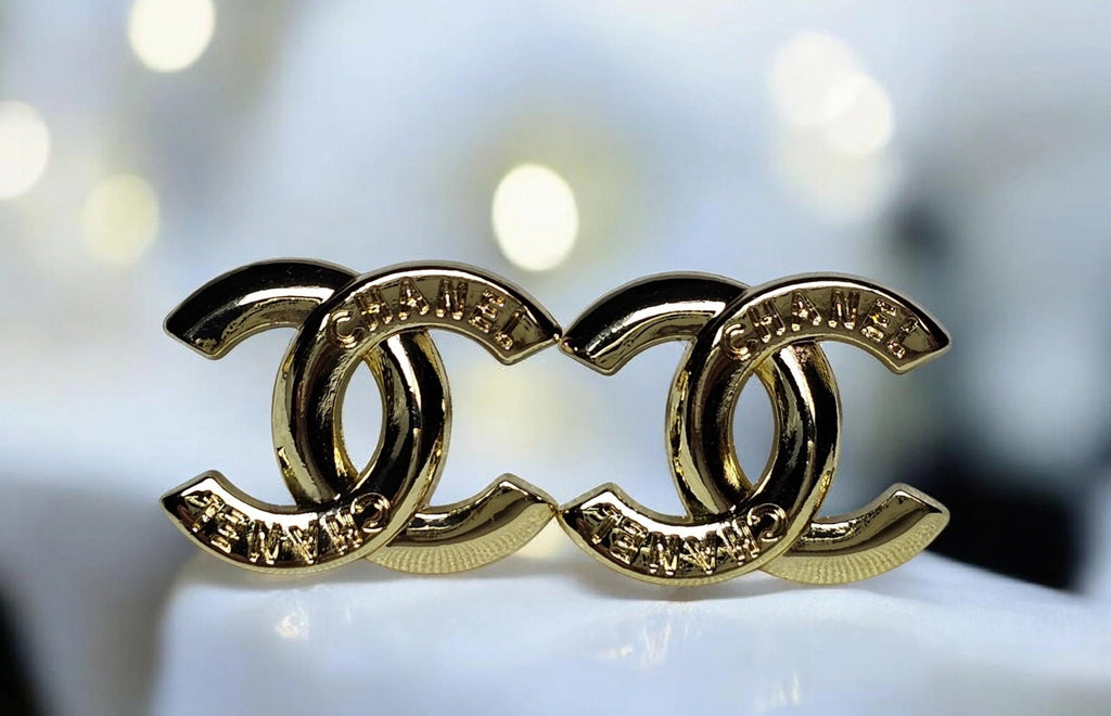 Chanel logo charm CC pierced stud earrings