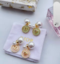 CD Logo Pierced Stud Earrings